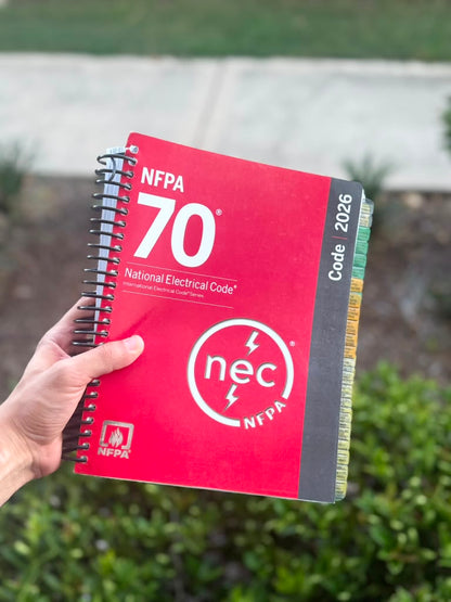 Tabbed NEC 2026 Spiralbound codebook open to article, ready for electrician exam
